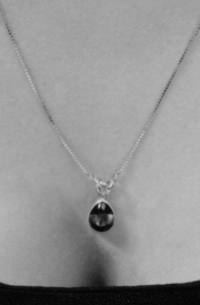 A beautiful necklace and pendant worn with a pendant positioner keeping the clasp out of sight.