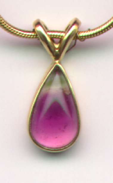 Front view of a necklace, pendant, and pendant positiioner at 10 times real size.